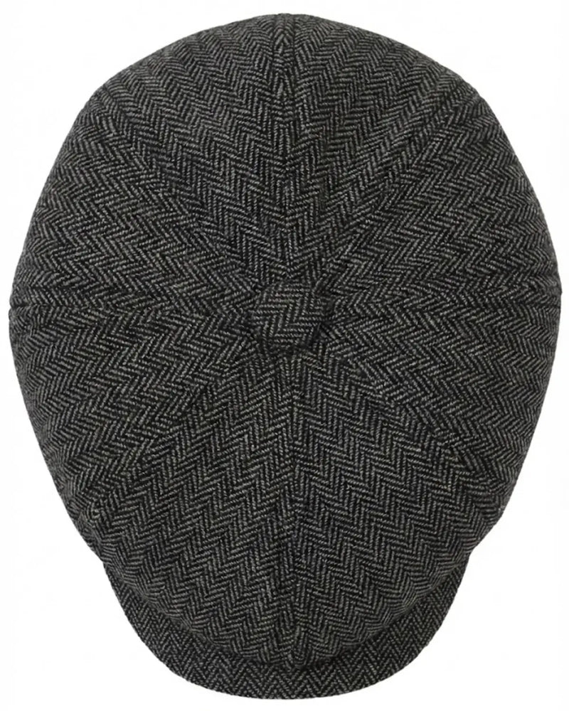 Vista superior da Boina Peaky Blinders, mostrando a construção clássica Newsboy de 8 gomos que se encontram no botão central e a textura do tecido espinha de peixe.